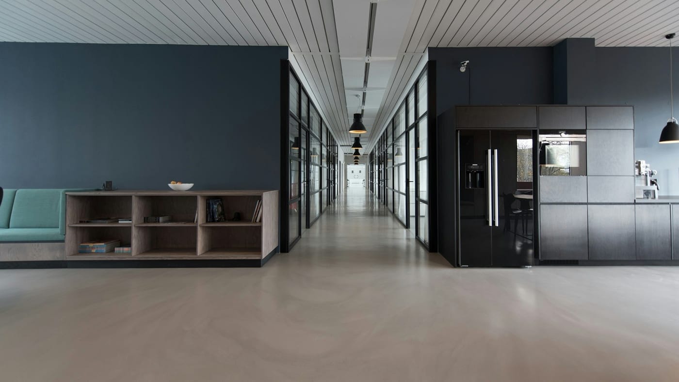 Modern office workspace with desk, chair, and natural light