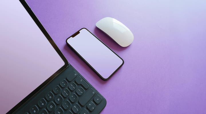 Sleek desk with laptop and smartphone